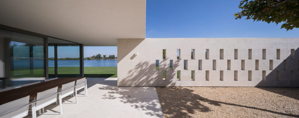 High-end residential facade utilizing light beige Vratza stone