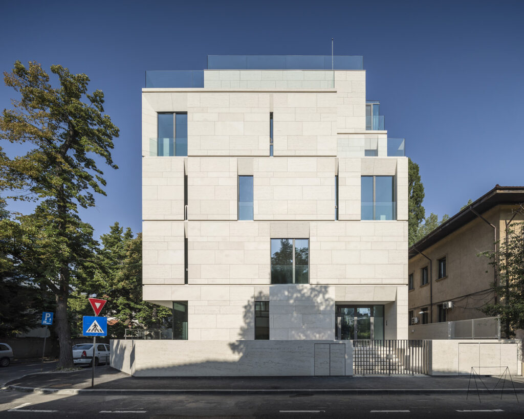 Award-winning ADNBA architecture featuring geometric stone cladding