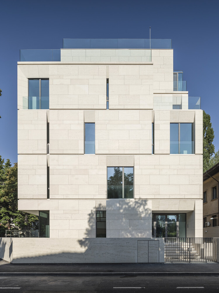 Monolithic Vratsa limestone facade of the MORA Residential Building