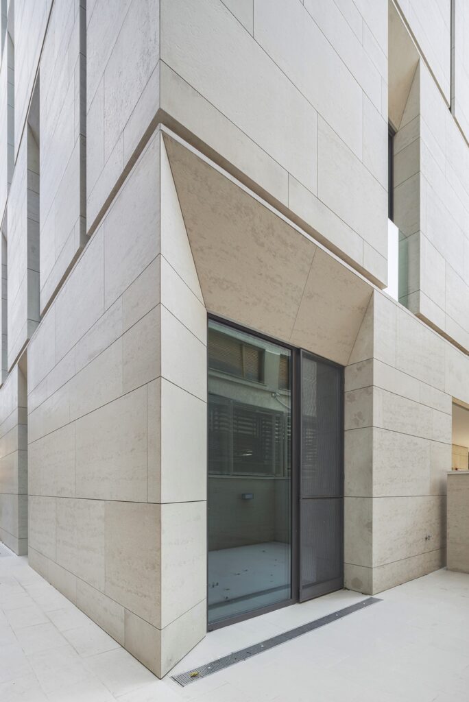 Contemporary residential exterior utilizing light beige Bulgarian stone